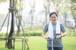© Suriyo - Portrait Asian women middle aged playing scooter in city park in concept healthy strong insurance retire Financial freedom