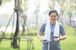 © Suriyo - Portrait Asian women middle aged playing scooter in city park in concept healthy strong insurance retire Financial freedom