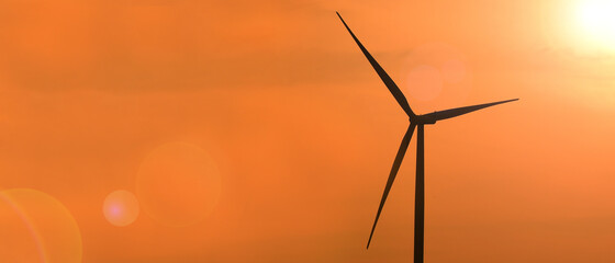 Windmills for electric power production at sunset