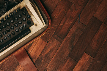 Fototapete - vintage typewriter with white paper stands on the floor indoors top view