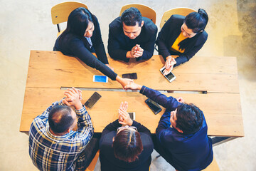 Wall Mural - Group of diversity people fist bump holding hands together power of tag team. Teamwork Multiethnic people group working togetherness. Business people team holding hands successful. Business meeting