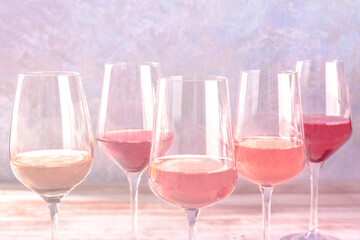 Various styles of rose wine, side view with a place for text, toned image