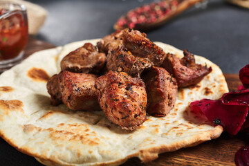 Canvas Print - Kebab  with garnish on flatbread