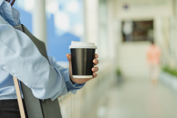 Beautiful Woman hold cup of coffee in the morning.