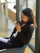 © bongkarn - Businesswoman drinking coffee while relaxed sitting in cafe