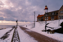Snow Covered Beach During Wnter By Urk Lighthouse In The Netherlands. Cold Winter Weather In The Netherlands