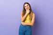 © luismolinero - Young woman over isolated purple background happy and smiling