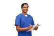 © Syda Productions - healthcare, profession and medicine concept - happy smiling indian doctor or male nurse in blue uniform writing medical report on clipboard over white background