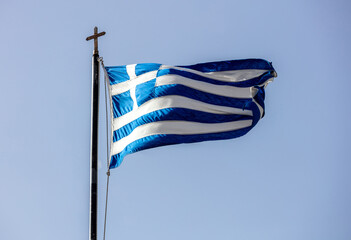 Sticker - Greek flag on flagpole waving on blue sky background