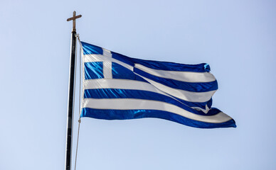 Sticker - Greek flag on flagpole waving on blue sky background