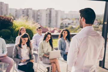 Sticker - Back rear spine view photo of young confident bossy man businessman having meeting with colleagues outside outdoors