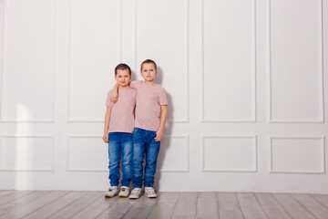 Two boys pose for a photo shoot