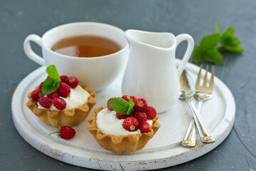 Wall Mural - Wild strawberry tartlets with cream filling. delicious summer fruit mini tarts