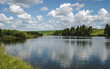 Calm landscape of lake with clouds, rural landscape