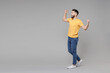 © ViDi Studio - Full length young caucasian serious bearded attractive handsome man 20s in yellow basic t-shirt do winner gesture clench fist look aside isolated on grey background studio portrait People concept.