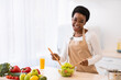 © Prostock-studio - Cheerful African Housewife Cooking Vegetable Salad In Kitchen At Home