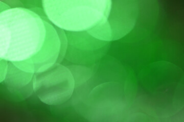 Poster - abstract green bokeh lights for ST Patrick's day celebration design background