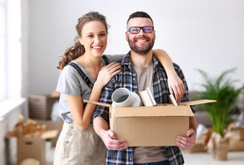 Wall Mural - Cheerful couple with carton boxes together in new flat