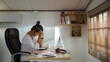 © torwaiphoto - Asian woman She works at home She is stressed