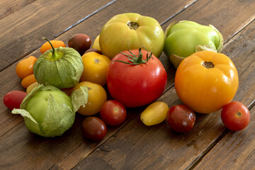 Sticker - Closeup shot of fresh and wet vegetables on a wooden table