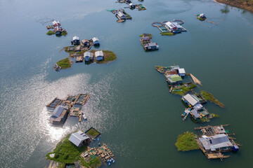 Floating local Fishing Village Houseboats with Fish Farms aerial view