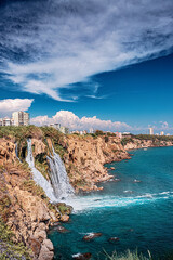 Wall Mural - The picturesque and powerful Duden waterfall, a water stream breaks from a high cliff - this is a very popular place for tourists and a business card of Antalya and Turkey
