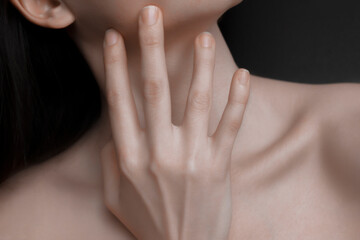 Woman neck and chin touching neck. Smooth skin