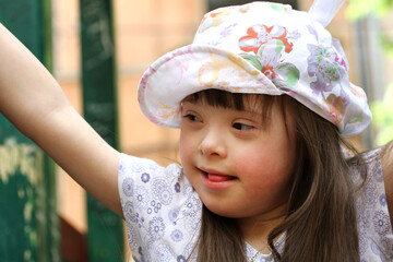 Wall Mural - Portrait of beautiful young girl on the playground.