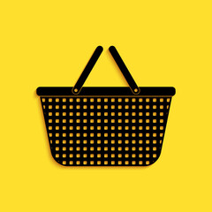 Poster - Black Shopping basket icon isolated on yellow background. Online buying concept. Delivery service sign. Shopping cart symbol. Long shadow style. Vector.