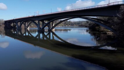 Wall Mural - Aerial view of bridge with reflections in the water