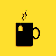 Wall Mural - Black Cup of tea with tea bag icon isolated on yellow background. Long shadow style. Vector.