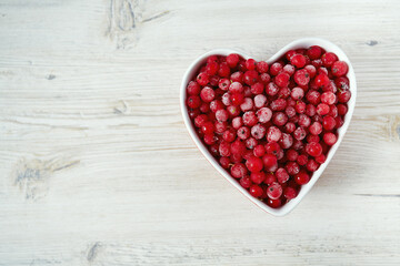 Sticker - frozen red currants on wooden surface