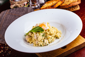 Canvas Print - Couscous with chicken and egg on a white plate