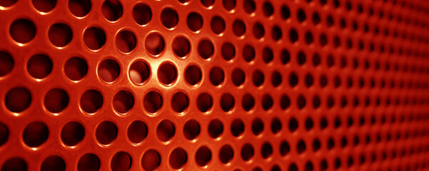 red metal lattice with holes as an abstract background