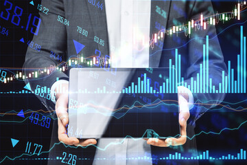 Poster - Forex and trading concept with businessman shows digital tablet display and stock market chart with glowing business candle sticks. Double exposure