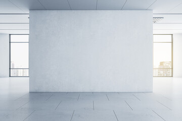 Poster - Light blank concrete wall in the center of empty hall room with big windows and city view. Mockup