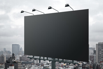 Aufkleber - Huge blank black outdoor billboard with lights on top at city background. Mockup