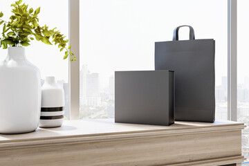 Wall Mural - Sunny room area with light vases on light wooden surface and empty black paper bag and black box. Mockup