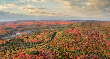 Wall Mural - Sunset Autumn drive through the tunnel of Trees in Michigan Upper Peninsula UP - Highway 41  M26 Aerial view