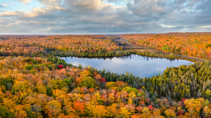 Canvas Print - Autumn aerial view of Donken lake on the drive through the tunnel of Trees in Michigan Upper Peninsula UP - Highway 41  M26 Aerial view