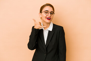 Young skinny caucasian business woman isolated showing a mobile phone call gesture with fingers.