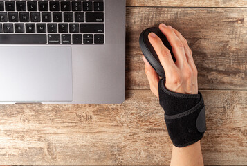 Wall Mural - chronic trauma to the wrist joint in people using computer mouse may lead to disorders that cause in