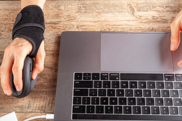 Wall Mural - chronic trauma to the wrist joint in people using computer mouse may lead to disorders that cause in