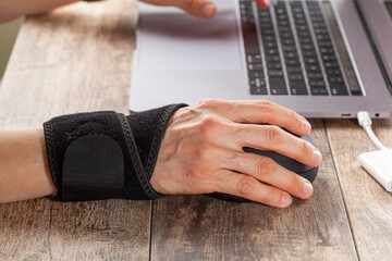 Wall Mural - chronic trauma to the wrist joint in people using computer mouse may lead to disorders that cause in