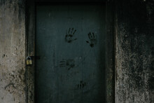 Creepy Old House Back Door Locked, Dirty Hand Marks On The Wooden Door, Walls Has Not Painted In Years, Concept Of Poverty In Village Life.