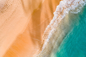 Wall Mural - Summer seascape from drone. Tropical beach and waves, Turquoise water abstract background from top view. Vacation Travel and idea concept.