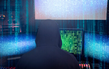 Hacking and malware concept. Hacker using abstract laptop with binary code digital interface.