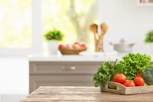 Tray With Vegetables On Table In Modern Kitchen