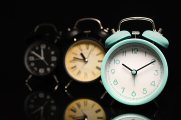 Alarm clocks on black background