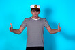 © Denis - Funny experienced sailor ready for marine travel. Cheerful young sailor. Expression of emotions. The guy is posing on a blue background.